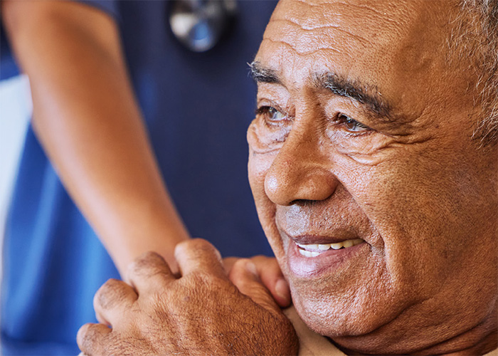 man with hand on shoulder