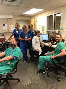 Drs. Maurice Page, Brandon Murphy ('18) along with NP Nancy Earls and Chief Surgery Clinic Staff
