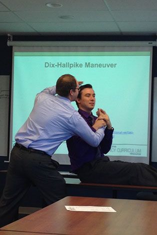 two people showing the dix hallpick maneuver